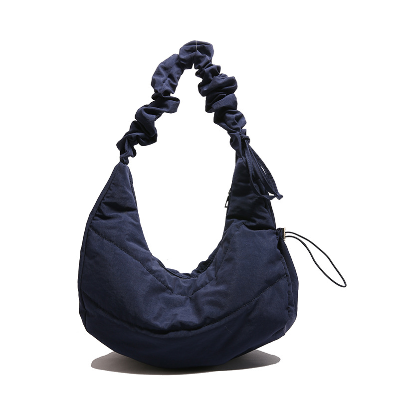 Bolso debajo de la axila para mujeres 2025 primavera nuevo diseño bolso plegado simple nicho bolso de hombro de mujeres