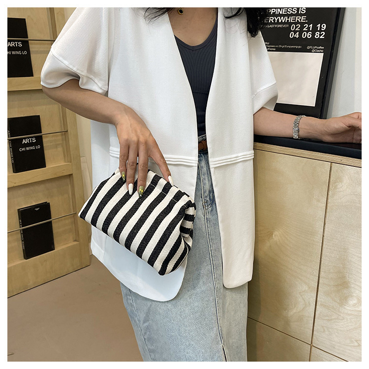New cross-border fashion color-blocking striped cosmetic bag, women's loose change mobile phone storage bag, trendy and niche cloud clutch undefined