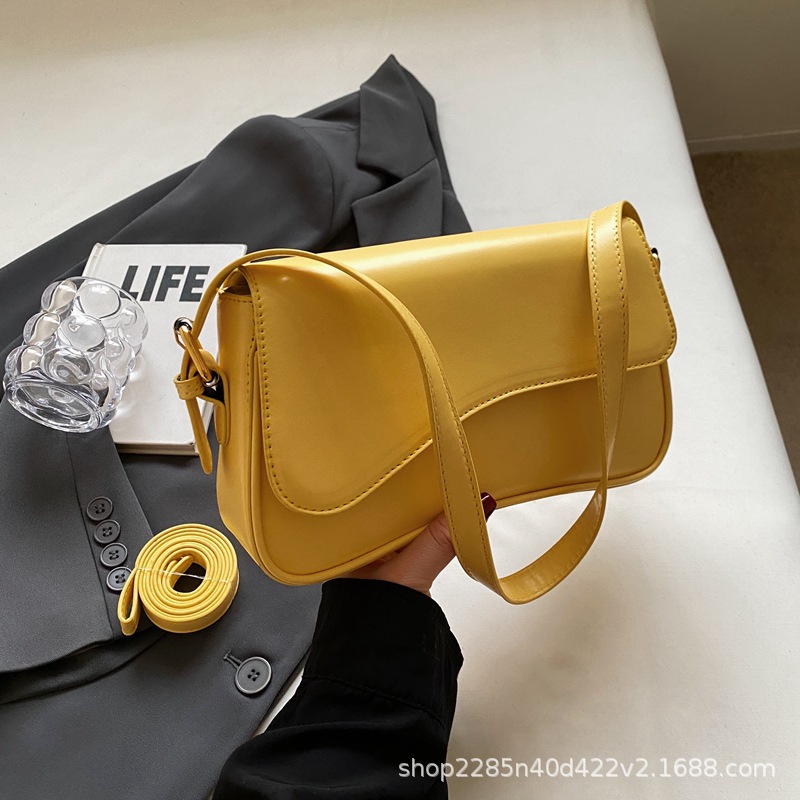 Bolso de hombro con hebilla magnética de nuevo estilo de alta calidad para viajar al trabajo, bolso de mujer simple de moda, bolso de axila, portátil diagonal