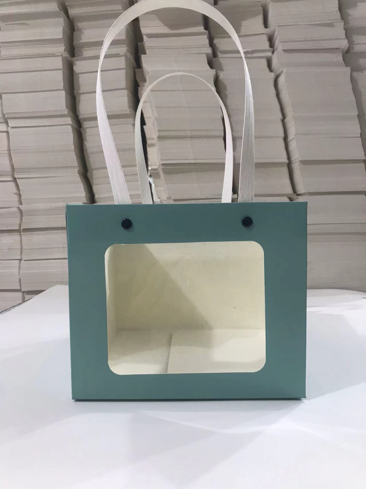 Bolso de mano con remache sonriente con ventana abierta transparente, caja de regalo de embalaje de vacaciones, joyería de juguete exquisita, bolsa de embalaje de plantas verdes al por mayor