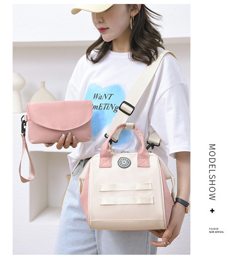 The Mommy bag is small and cute. It has a detachable front pocket and is a multi-functional baby bag. It is waterproof, lightweight, and has a crossbody design. It can be used to carry milk bags undefined