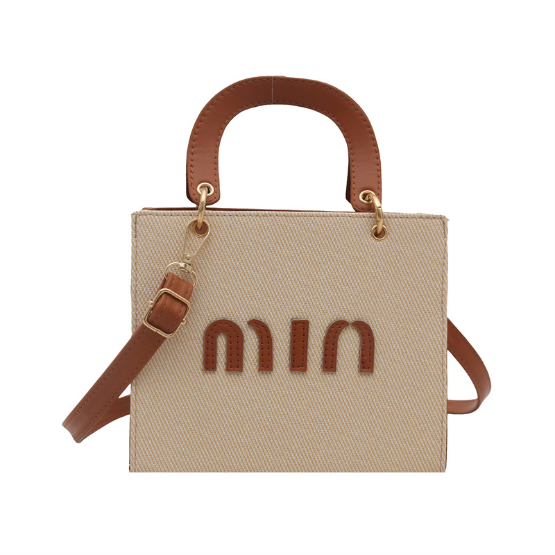 Bolso de mano de moda al por mayor color contraste bolso de mujer 2025 verano nueva letra de lujo bolso de hombro de viaje mochila