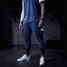 男士运动休闲长裤梭织健身跑步弹力工装裤跨境训练抽绳收腿长卫裤