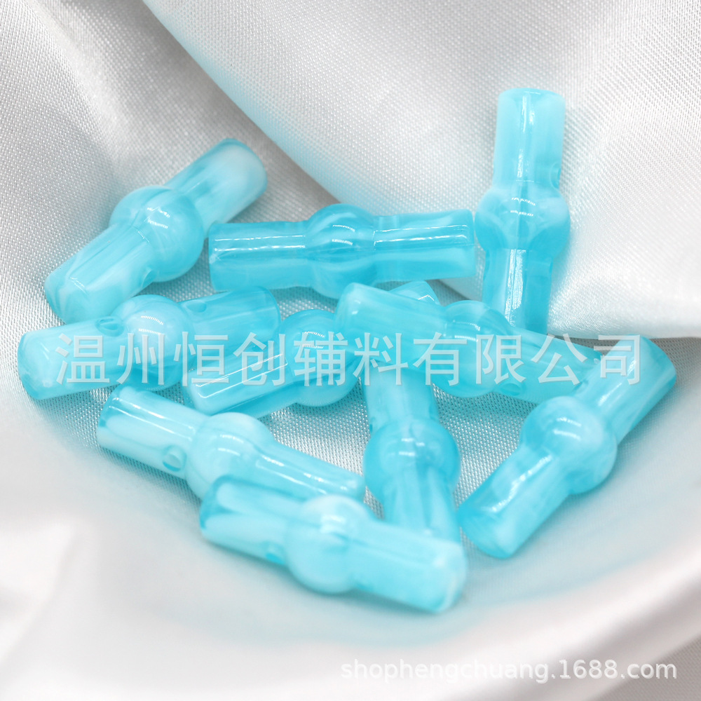 25x9mm brillante Hengchuang botón de resina cilíndrica de dos agujeros botón de estilo nacional suéter de punto botón de color de bricolaje al por mayor