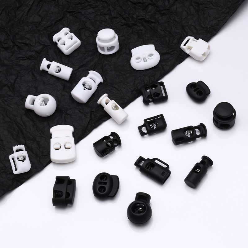 Ropa de nylon blanco y negro hebilla de resorte ajustación hebilla de apriete botón de hebilla antideslizante sombrero hebilla fija botón