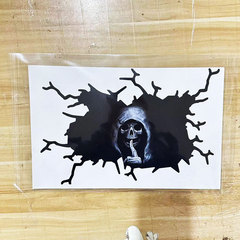 Creative sticker with a silent skull head on the back window of a horror-themed car, featuring devil-themed stickers, made by the manufacturer.