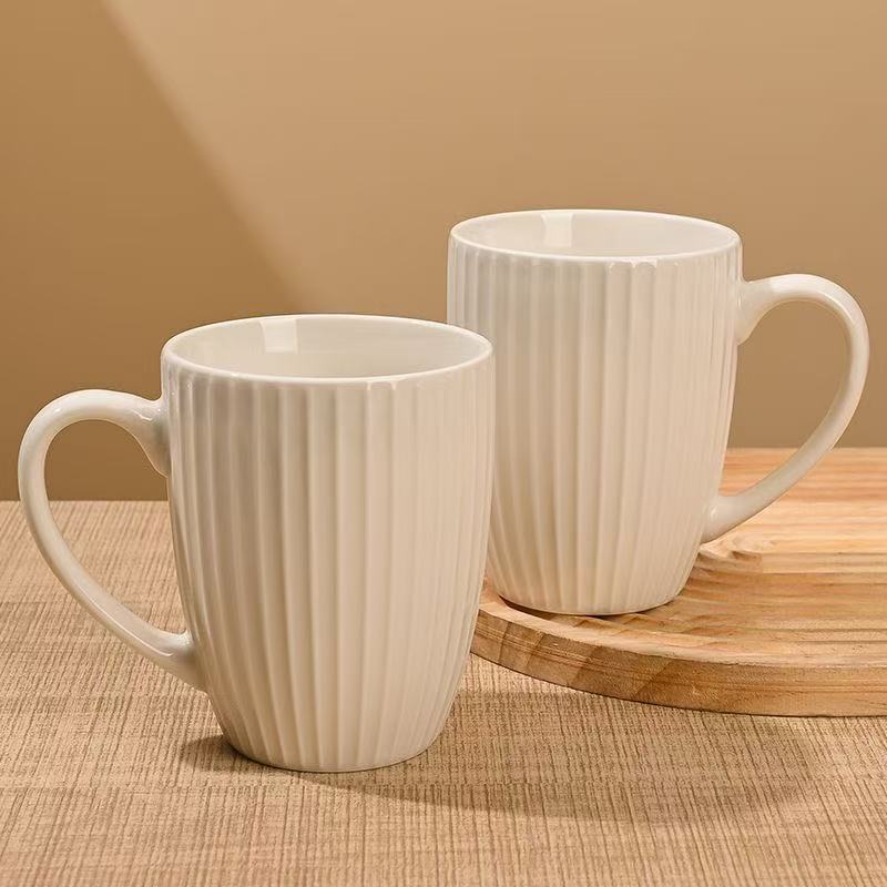 Taza de cerámica blanca pura simple taza de relieve taza de café taza de leche de gran capacidad taza de agua de oficina