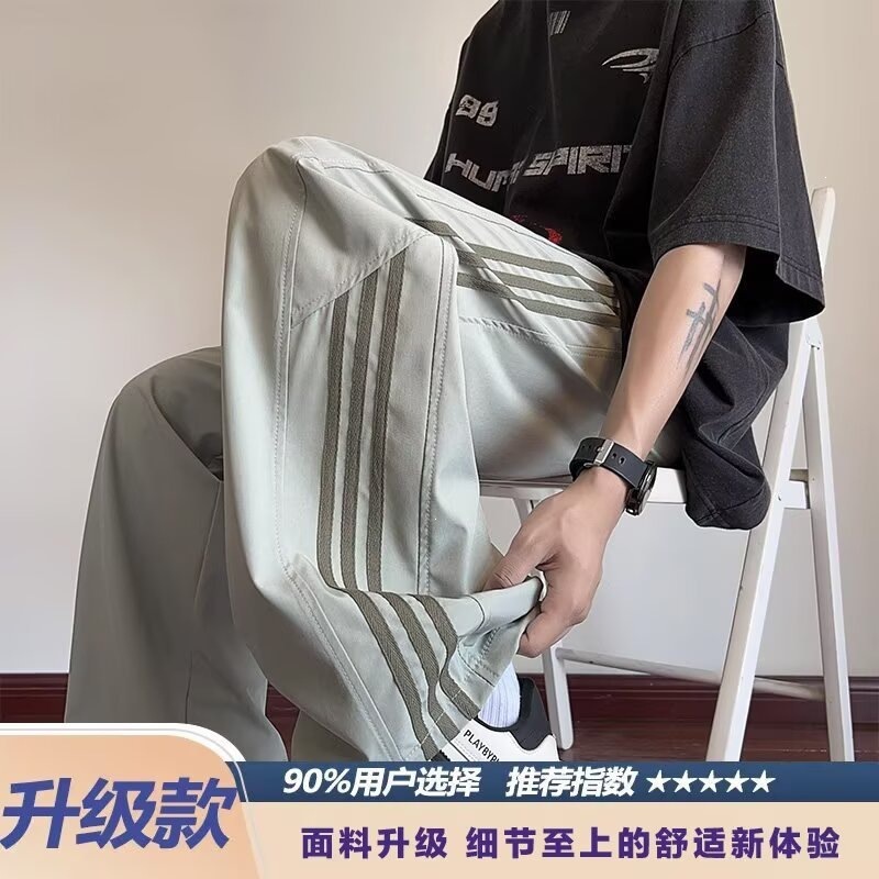 Pantalones casuales a rayas para hombres de primavera y otoño nuevos estudiantes adolescentes sueltos comercio exterior americano tres pantalones para hombres de verano