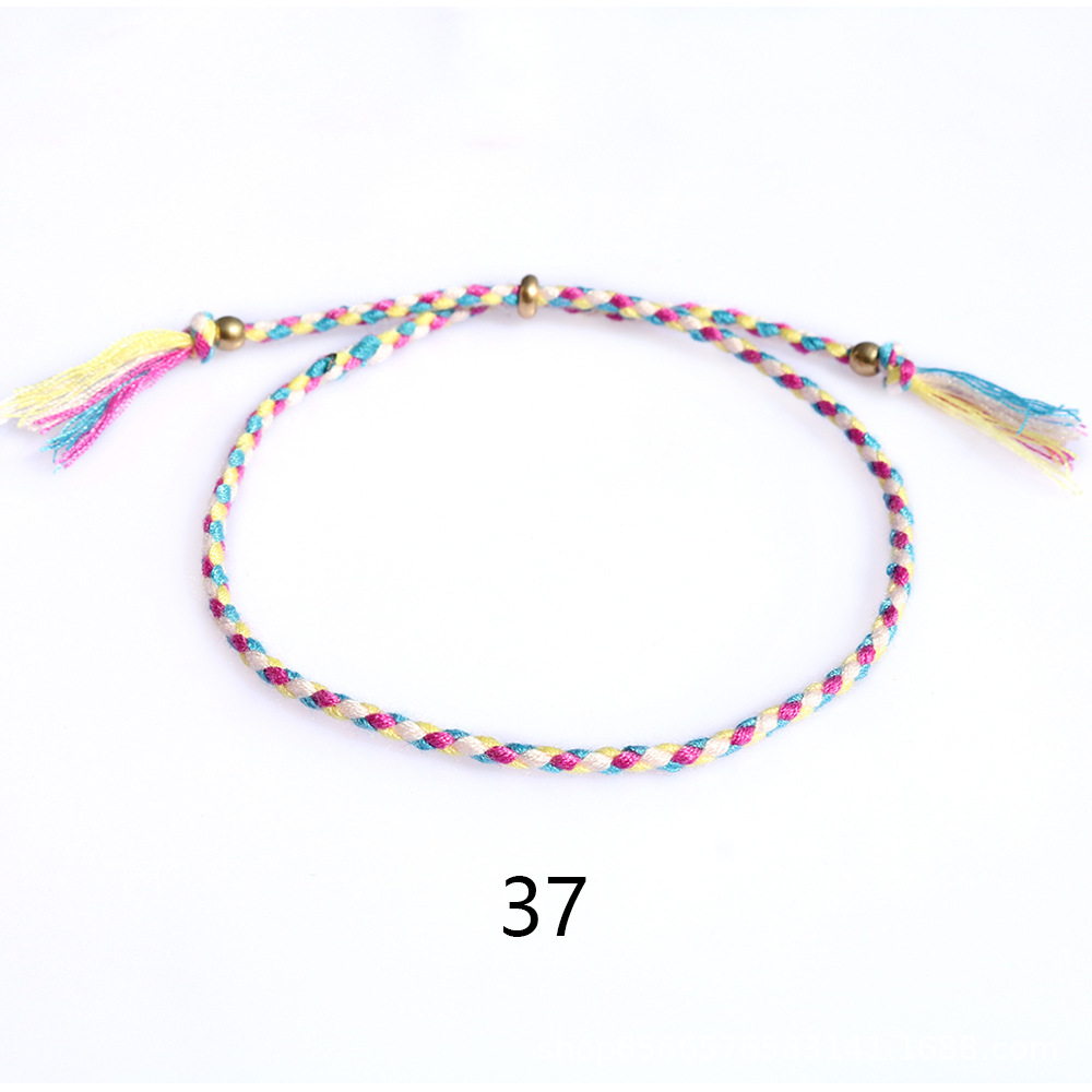 Amazon popular colorido cuerda de algodón amistad pulsera perlas de cobre borla pulsera tejida a mano ajustable hombres y mujeres pulsera