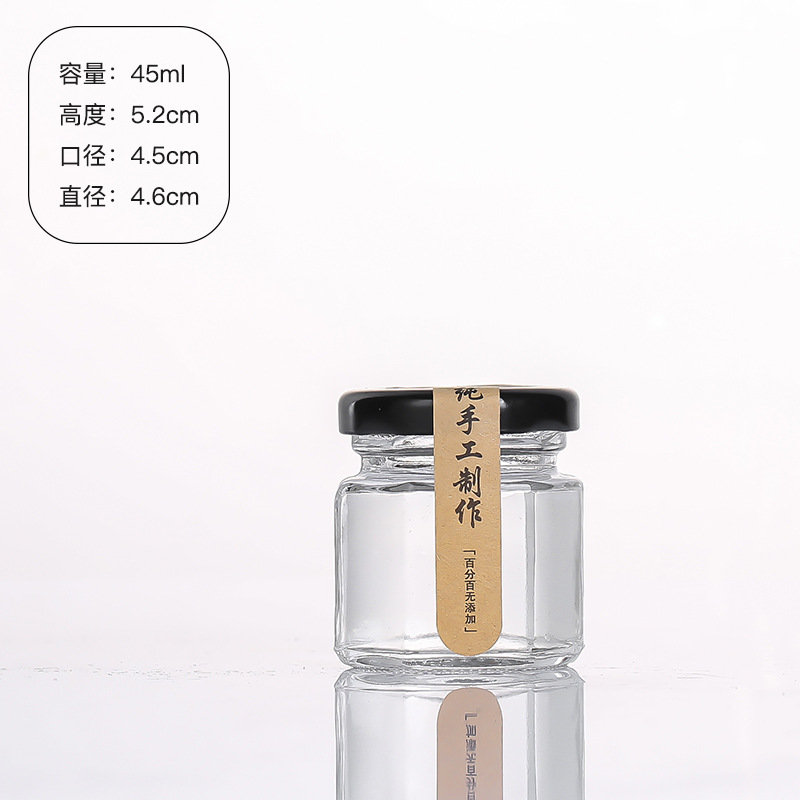 Hexagonal de vidrio enlatado sellado de grado alimenticio con tapa vacía un kilo de pasta de limón, miel, pimienta, botella de mermelada