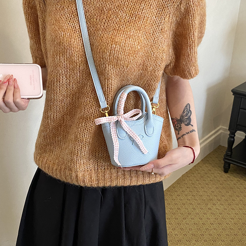 Nuevo bolso para niños coreano simple color sólido bolso de cubo para niños y niñas lindos arco mini bolso de mano bebé