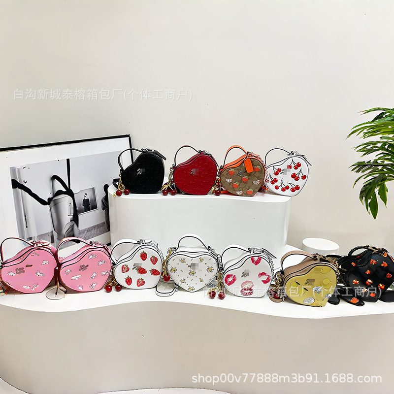 Bolso de mano en forma de corazón de comercio exterior, bolso de hombro de impresión de moda creativa, bolso de hombro simple, bolso de hombro de dama de Europa y América.