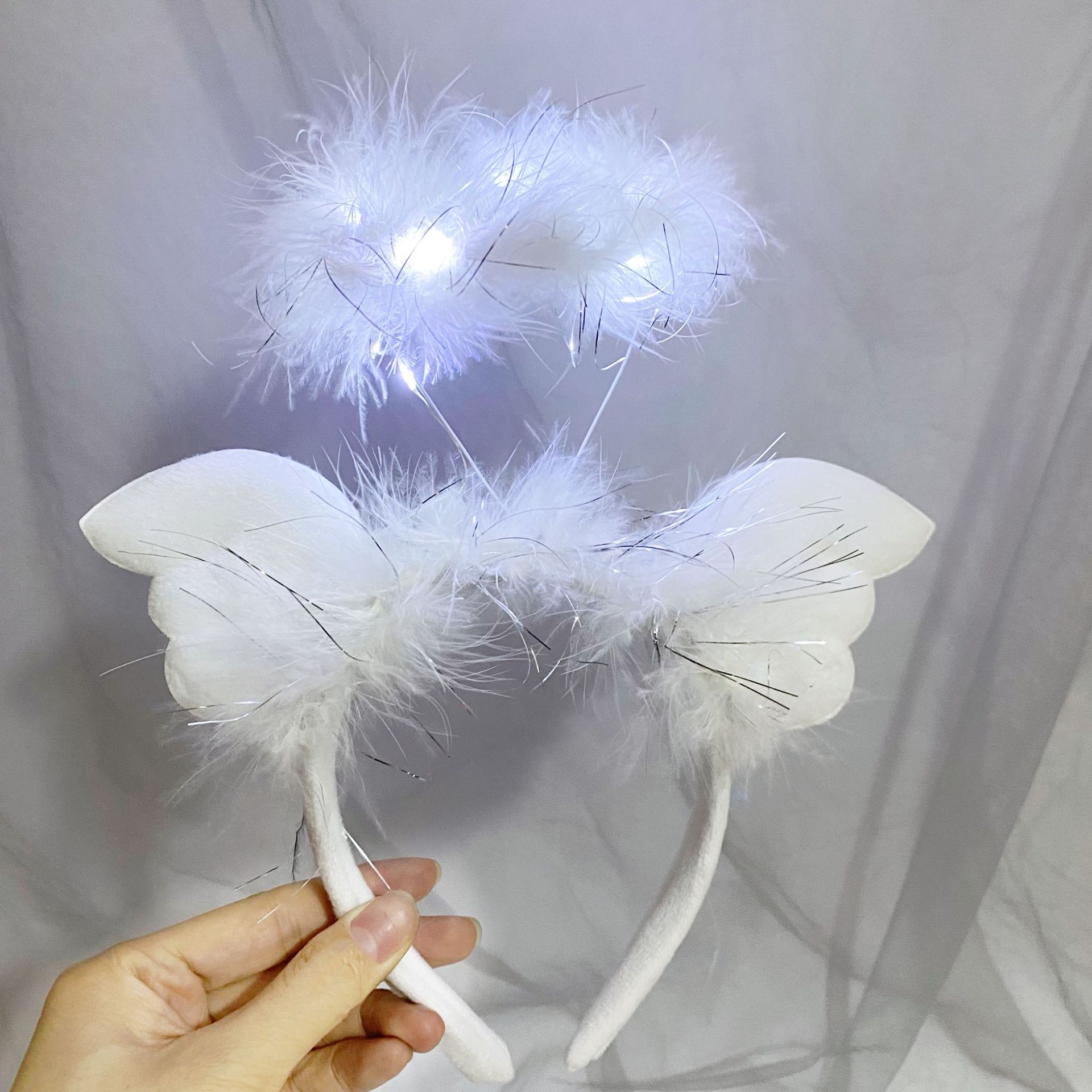 Nueva diadema con orejas de conejo de plumas con luces intermitentes, accesorio para la cabeza súper brillante, horquilla luminosa, popular en atracciones turísticas y puestos callejeros, venta al por mayor.