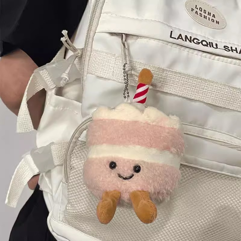 Pastel de peluche pequeño colgante lindo estudiante amiga bolsa de regalo extraña muñeca muñeca muñeca máquina de peluche lote