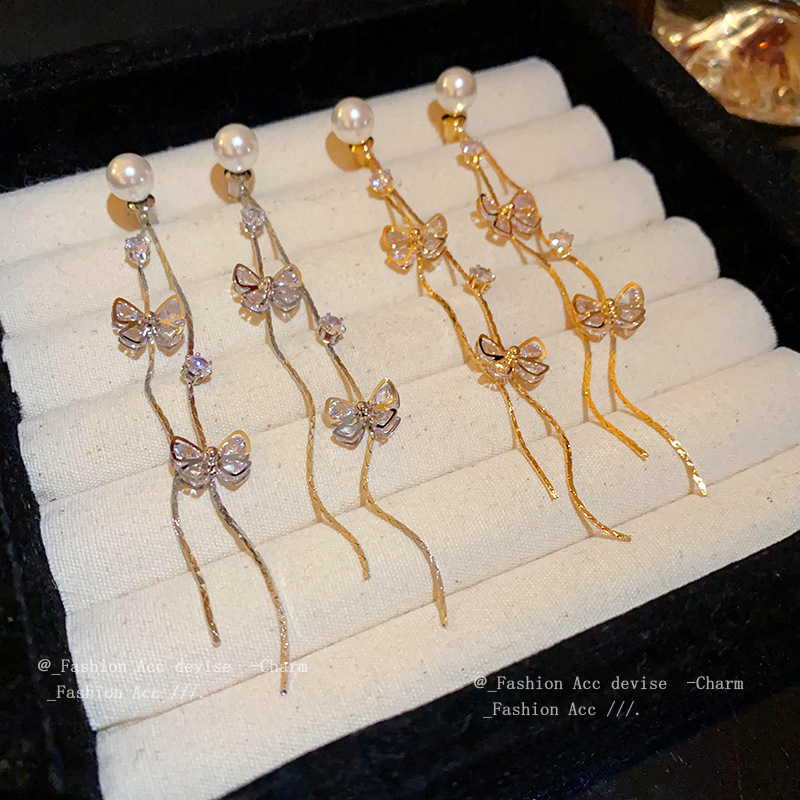 Retro fashionable earrings with zircon with bow from pearl