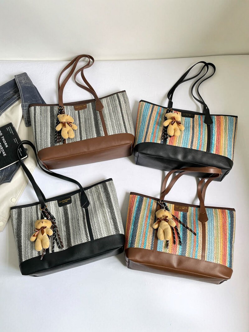 2026 nueva bolsa de tejido de gran capacidad de viaje mochila de hombro universal bolso coreano osos colgante moda