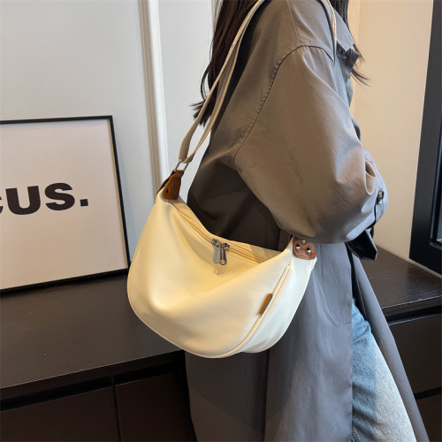 Foreign trade fashionable one-shoulder cross-body dumpling bag, versatile, large-capacity, high-end sense, ribbon, lightweight underarm canvas bag for women