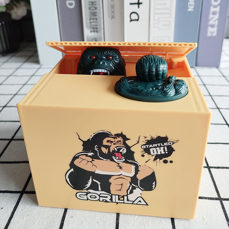 Cross-border new cartoon Money-Thief Godzilla dinosaur piggy bank gift King Kong gorilla electric savings jar decoration
