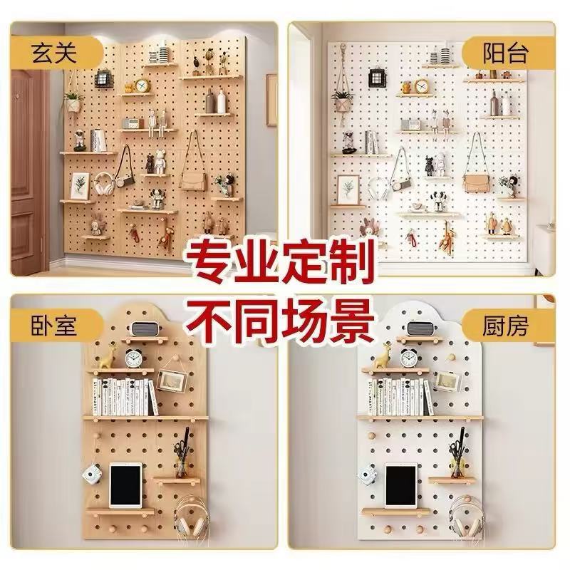Custom-made solid wood shelving unit with perforated panels, designed to conceal the electrical meter box in the entryway, creating a decorative wall and integrated dressing mirror