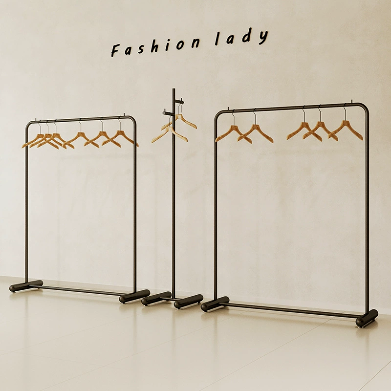 Полки для магазинов одежды, простые железные черные напольные вешалки для одежды, стеллажи для демонстрации детской одежды, молочно-белые стеллажи для магазинов женской одежды
