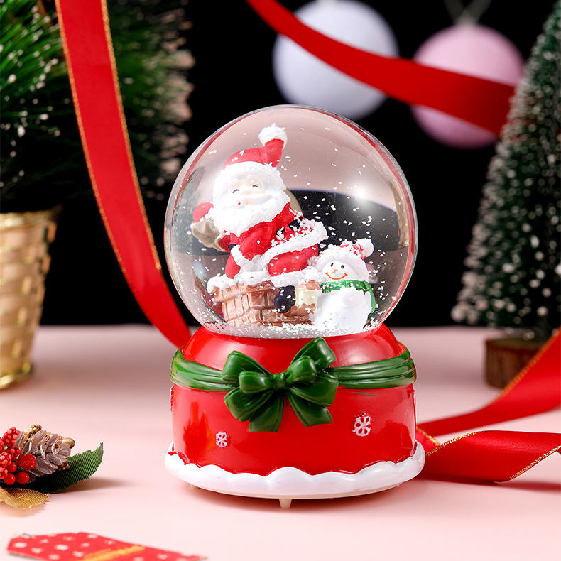 Una variedad de regalos de decoración de Navidad Navidad iluminante bola de cristal caja de música ventana diseño de velas lámparas de viento árbol de Navidad