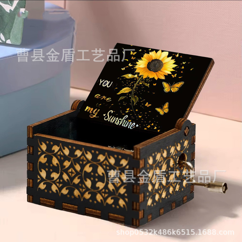 木製の手で音楽箱のアイデアを揺らします。|undefined