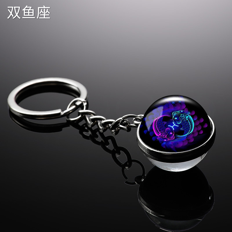 Transfronterizo 12 constelaciones de luz nocturna bolsos colgantes de bolsas de joyas de tiempo doble cara bola de vidrio llavero al por mayor