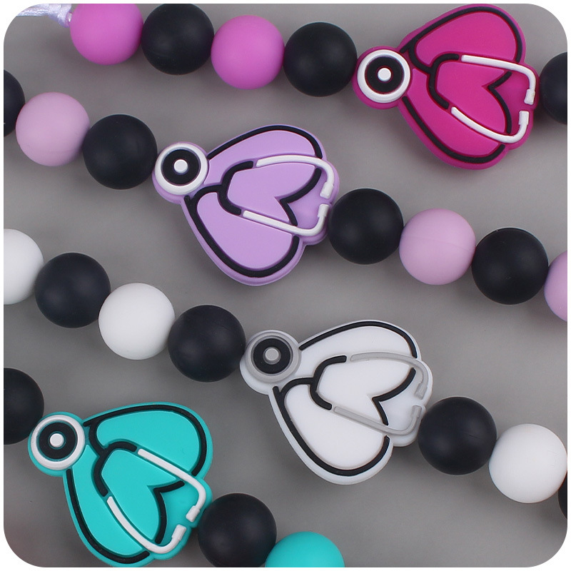 Nuevo bebé suministros de dibujos animados mariposa silicona mordedor calmante bebé DIY mordedura pegamento cadena anti-gota cadena