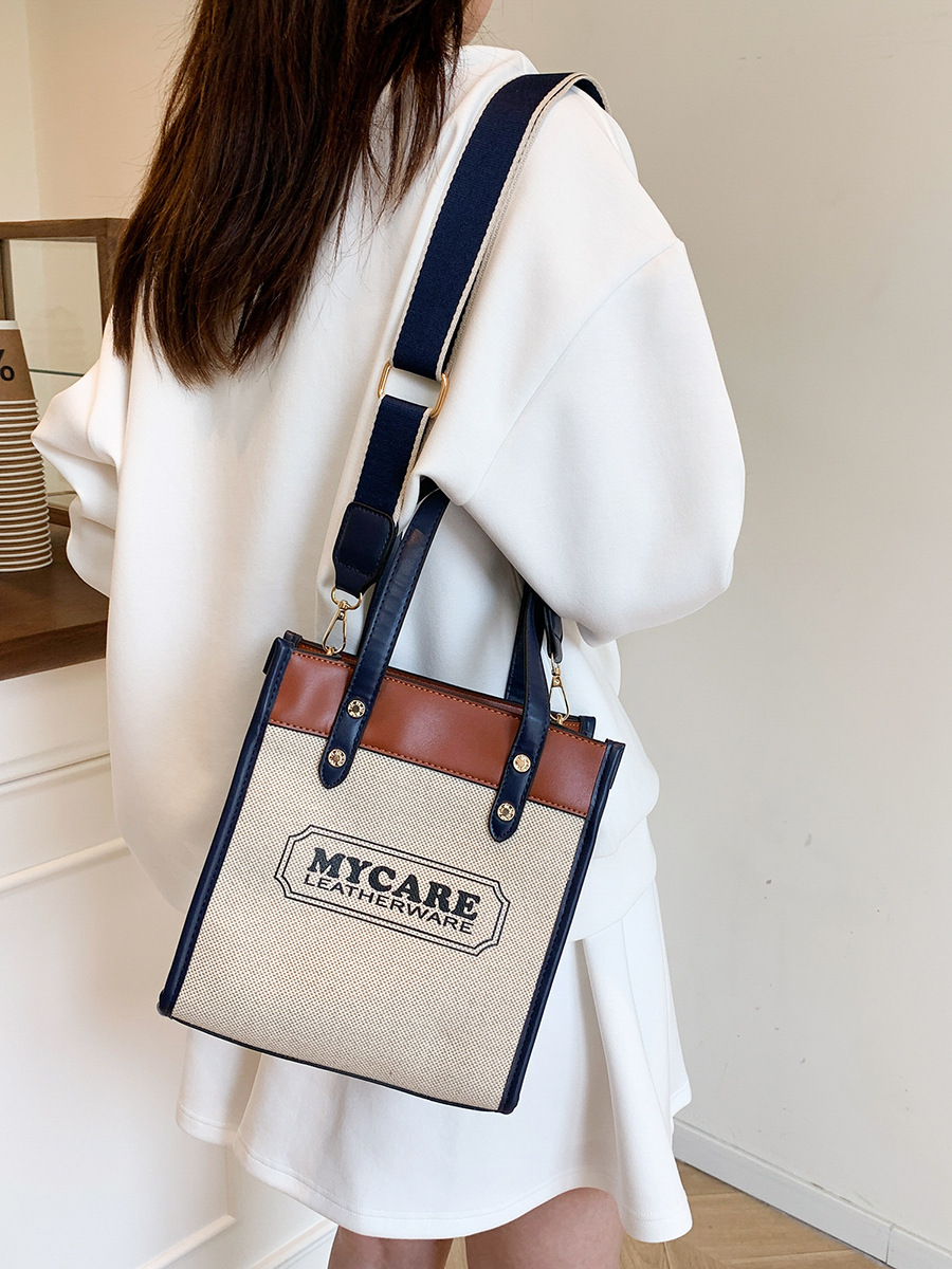 Nuevo cross-border bolso de empalme de color para mujeres 2025 verano lienzo de moda mochila de hombro simple bolsa de viaje