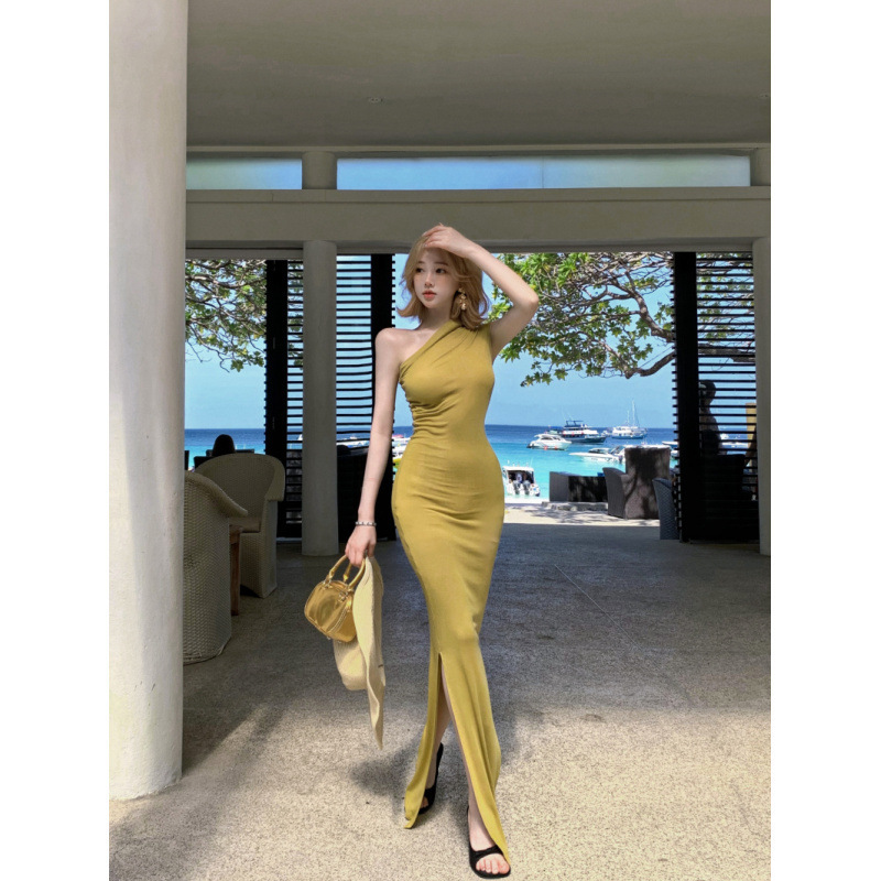 Sheer and elegant sleeveless mustard yellow asymmetrical one-shoulder halter neck pleated bodycon high-slit knit dress Sheer and elegant sleeveless mustard yellow asymmetrical one-shoulder halter neck pleated bodycon high-slit knit dress