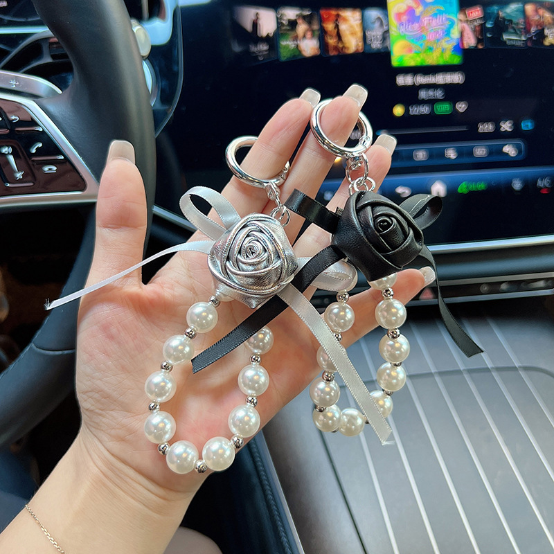 Cuero pu pequeño rosa llavero perla arco flores coreana llavero de automóvil bolso colgante bolso para mujeres