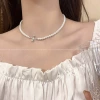 Silver necklace with bow from pearl