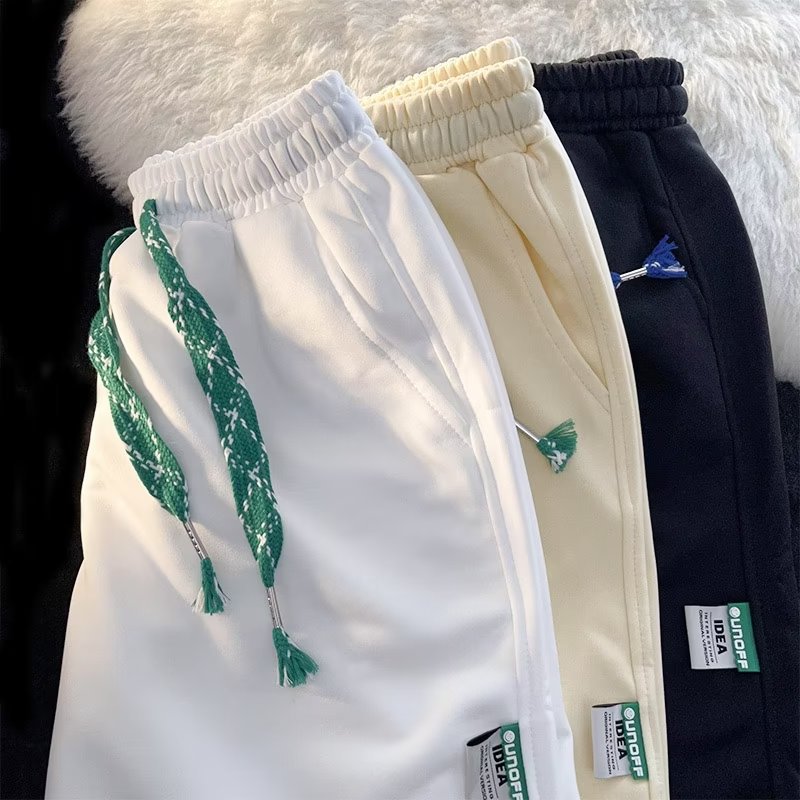 Pantalones cortos deportivos para hombres y mujeres de verano 2022 nuevos pantalones de longitud media estilo coreano negro pantalones cortos de pierna ancha rectos sueltos Casuales