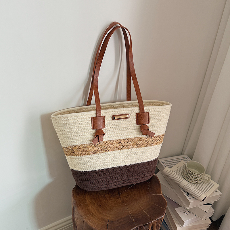 Bolso de mano de gran capacidad para mujeres 2026 verano nuevo estilo de moda tejido bolso de hombro brazaleta de viaje bolsa de ocio
