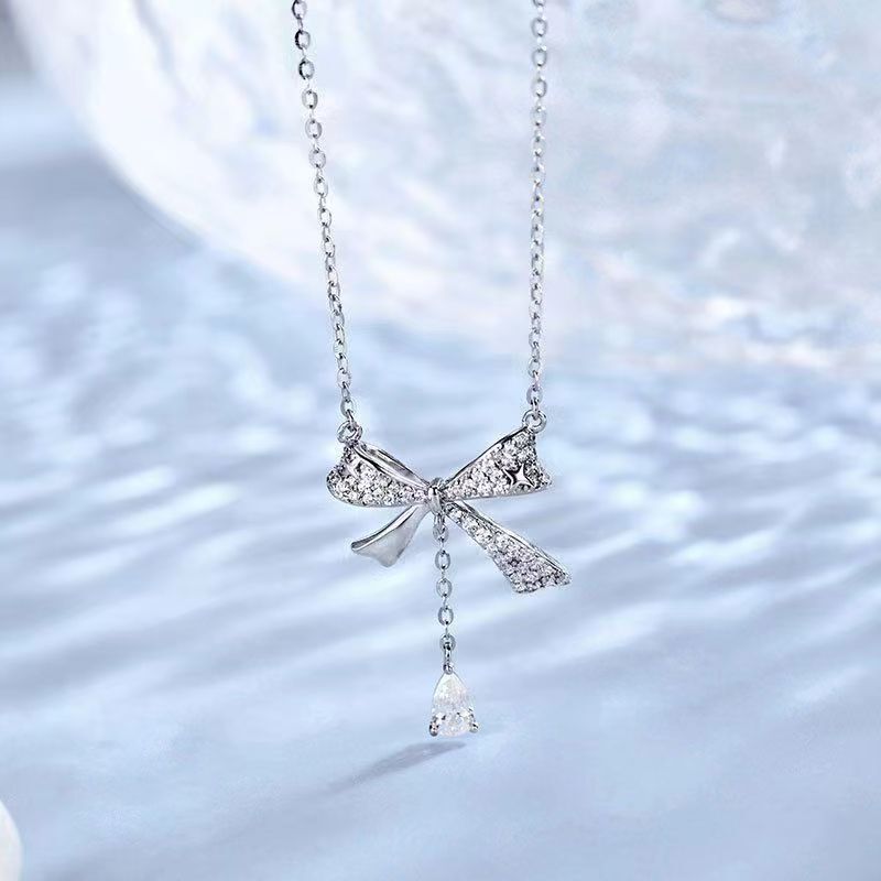 White copper Fangqi with official LOGO onion jewelry 2023 new tassel smart bow necklace for women light luxury
