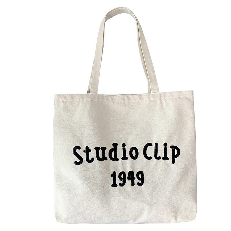 Estilo chino bordado bolsa de lona de los hombres femeninos de hombro nicho original simple letras artísticas de gran capacidad bolso de escuela del estudiante