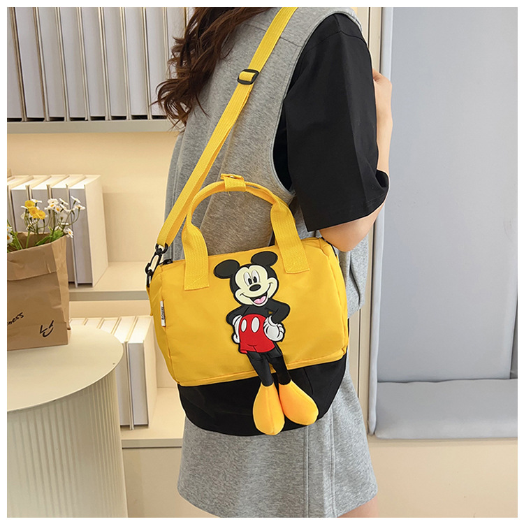 The 2021 new children's bags feature a cute Mickey Mouse pattern bowling bag for girls and a fashionable hand-held shoulder bag undefined