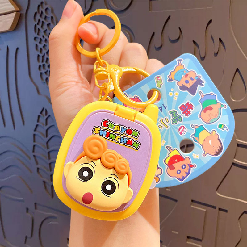 Crayons, mobile phone, game console, keychain