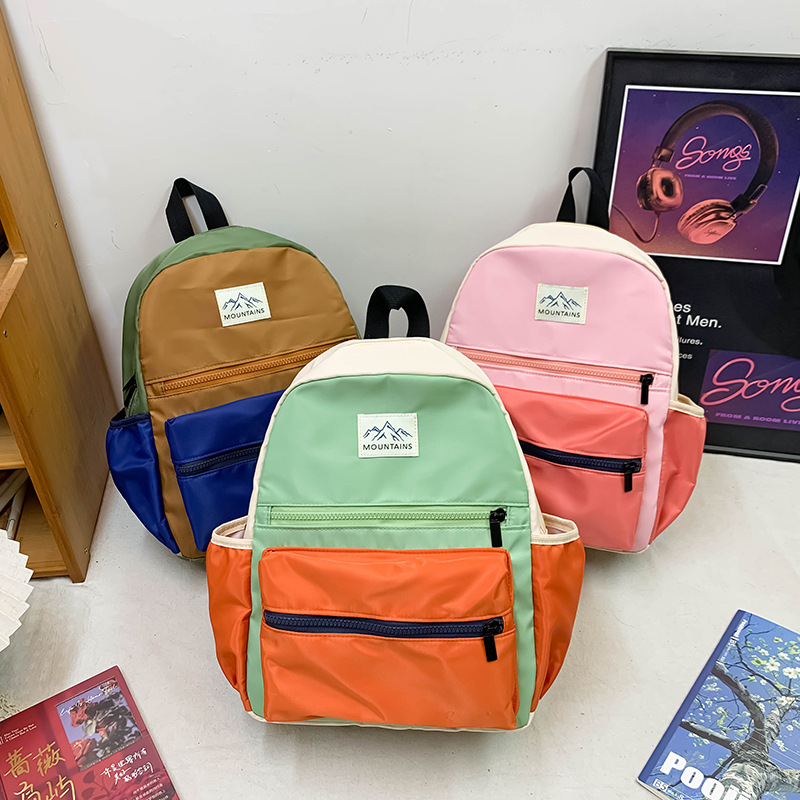 Mochila de clase de alta capacidad para estudiantes de primaria, moda, color de contraste para salir, mochila ligera para niños y niñas, nueva mochila infantil.