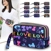 休闲潮时尚印花三拉手拿包2024跨境新款女士手拎包手机钥匙收纳包