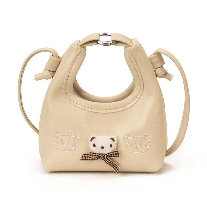 2026 nuevo bolso infantil de dibujos animados osos mini bolso de mano bebé adorable bolso de accesorios de niña pequeña