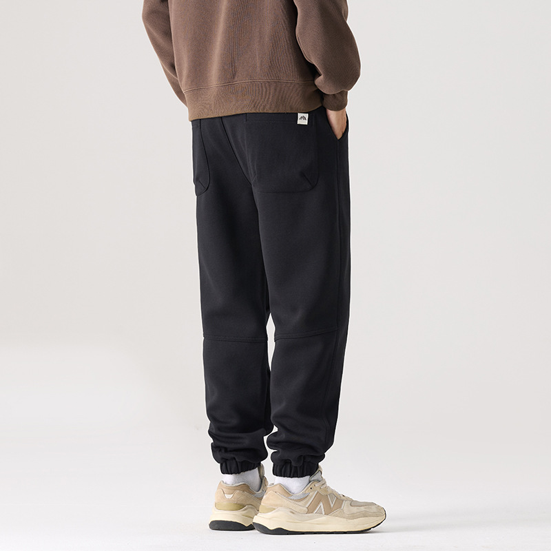 Mick Jones2025 caño hombre pantalones casuales holgados versátiles estilo coreano pantalones deportivos largos negros regulares