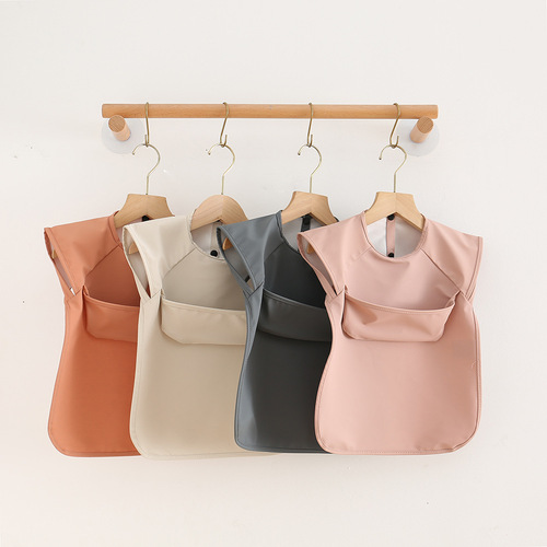 Danish children's sleeveless pu reverse-dressing baby eating clothes bib super soft waterproof solid color rice pocket anti-dirty feeding clothes