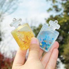 Cross-border new gift colored glitter perfume bottle stress relief toy, squeeze play small pendant toy wholesale