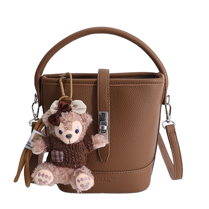 Litchi estampado bolso de cubo de mano mujer 2026 venta caliente nueva moda coreana alta textura mochila de hombro
