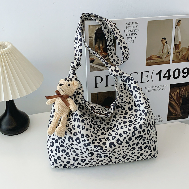 Estudiantes universitarios clase de viaje bolsa de gran capacidad para mujeres 2024 nueva moda extranjera leopardo tela mochila