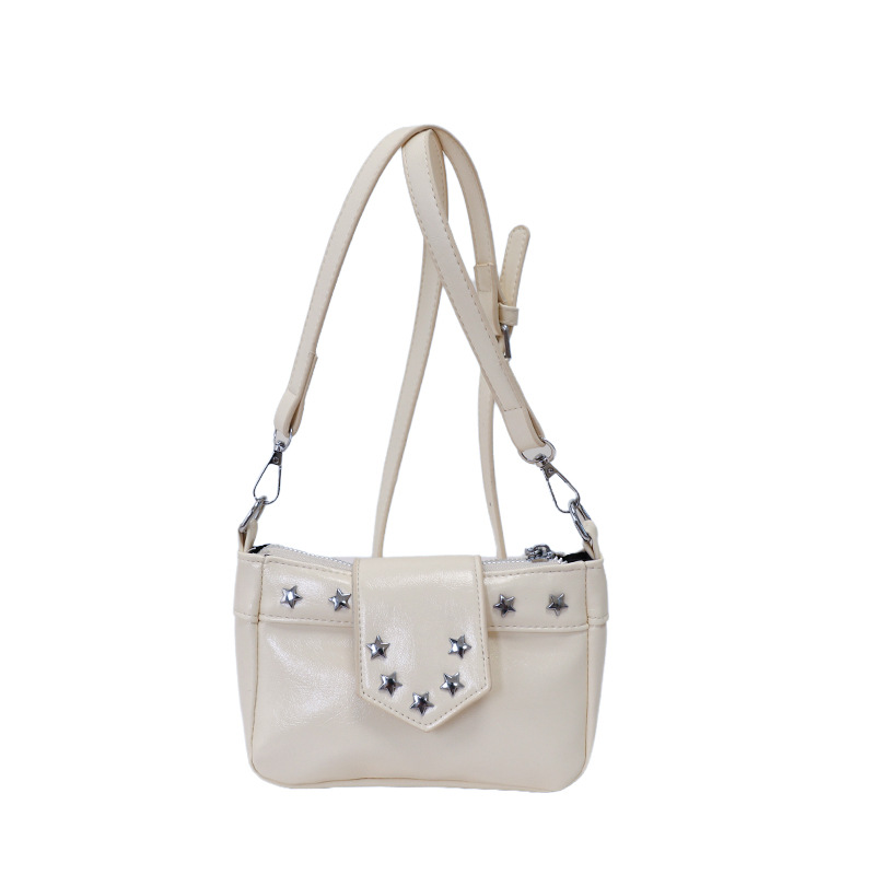 Simple retro bolso axilar 2026 nuevo bolso de remaches personales coreano en el temperamento bolso de hombro de viaje