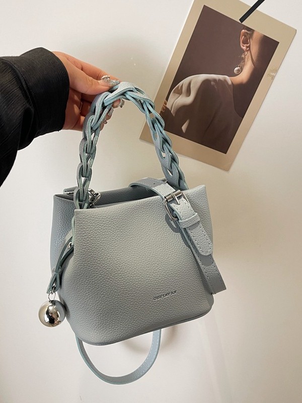 Bolso de mujer 2026 verano nuevo tejido a mano bolso de cubo de moda simple bolso de hombro mochila