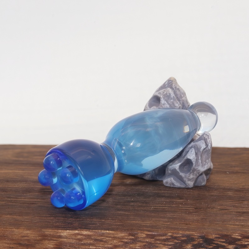 Resin Facial Gua Sha Massage Stick Zhuque Three-Prong Acupoint Tool with Lotus Bud Head for Face Meridian Care and Relaxation in use