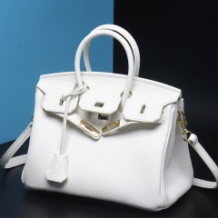 Timeless European and American-style fashion: Women's genuine top-layer cowhide pure white platinum bag with silver and gold hardware, featuring a sleek single-shoulder design.
